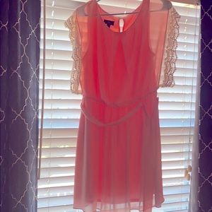 Short (knee length) peach dress with lace detail